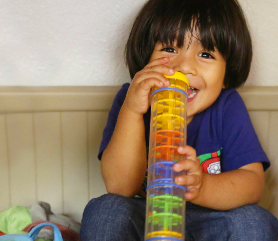 Movida Heights Foundation, Child smiling and playing